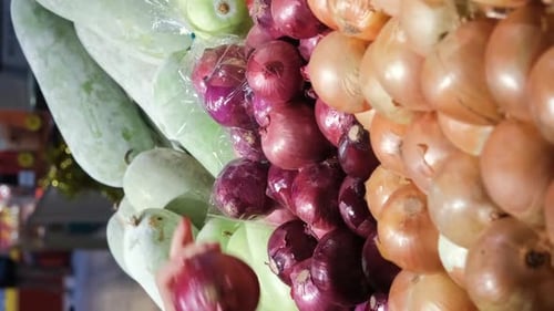 Closeup of Woman Buying Onions at Grocery