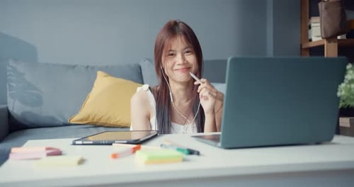 Woman Works at Laptop in Modern Home