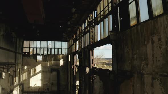Sun shining through windows inside old rundown abandoned factory ...
