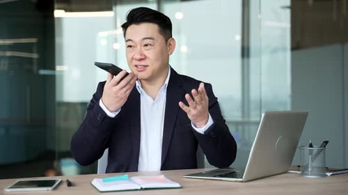 Professional Man on Smartphone Voice Call in Office