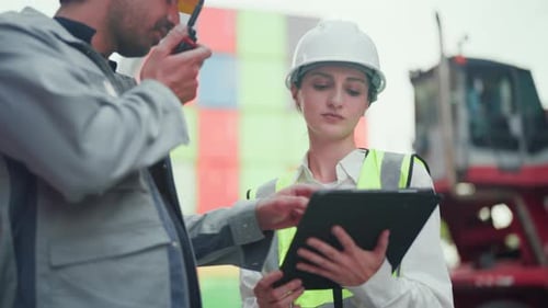Professional logistics workers using an AI-powered tablet