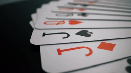 Playing Cards Beautifully Spread on a Dark Surface - Close-Up View
