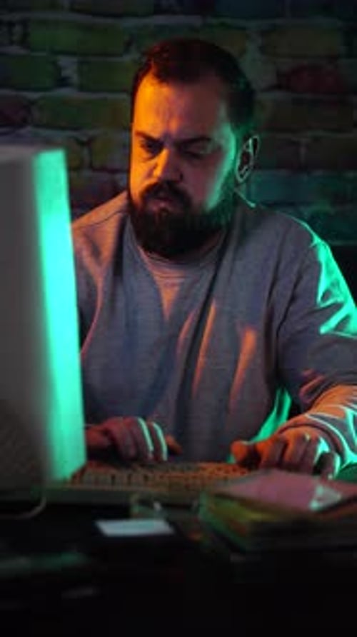 Vertical View, Tired IT Guy From 1980's Working Late NIght on Computer With CRT Monitor