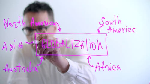Guy in a White Shirt Writes the Text on a Glass Board