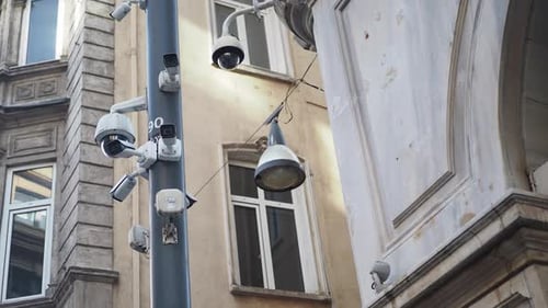 Many CCTV Security Cameras Operating on Buildings
