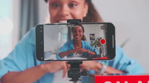 Woman Recording a Video at Her Desk