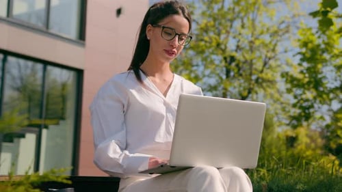 Woman Businesswoman Girl Female Business Lady Student Freelancer Typing on Laptop in City Outdoors