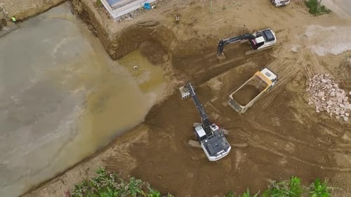 Aerial View Pouring the First Concrete Heavy Equipment at the Site
