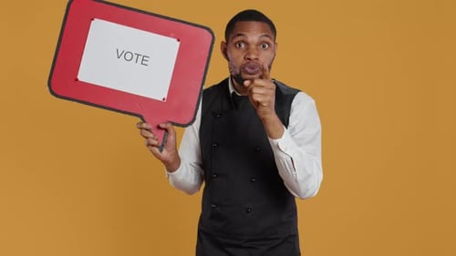 Man with Vote Sign Urging Action