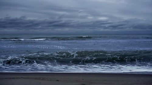 Blue waves crashing in dark storm sky powerful nature ocean landscape