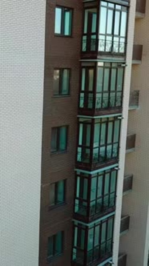 Building under construction. Aerial view of tall buildings under construction. Vertical video