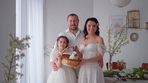 Smiling Family with Easter Basket in Festive Clothes Concept of Celebrating Spring Holiday