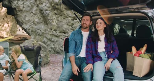 Family Camping Near Rock Cliff with Healthy Food