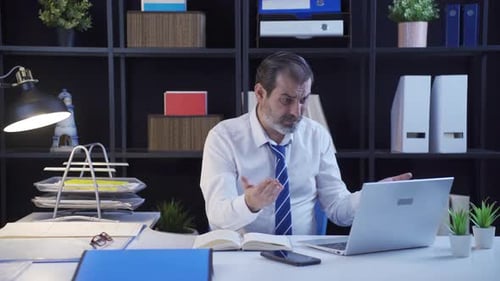 Worried Businessman Working in his Office