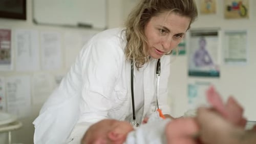 Doctor, baby and woman change diaper in hospital for healthcare service, check up or wellness