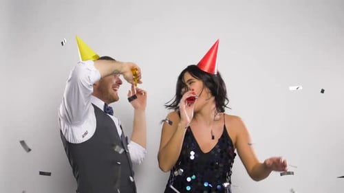 Couple Celebrating with Confetti and Party Favors