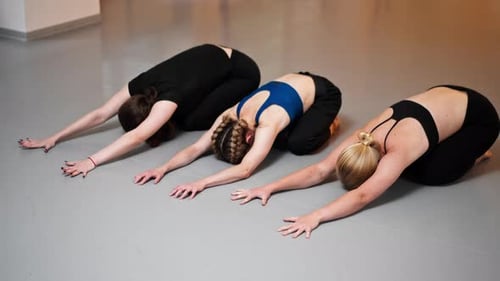 in Studio of Spiritual Development Master Class on Yoga Three Girls Pair Training Synchronous Posing