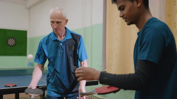 Coach Demonstrates Using Racket Handle To Play Tennis With Student ...