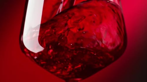 Red Wine Being Poured into Glass, Close Up