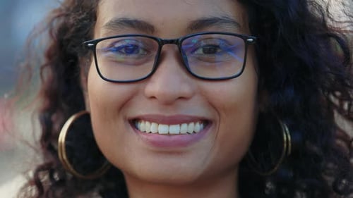 Smiling Woman Wearing Glasses in Close Up Portrait
