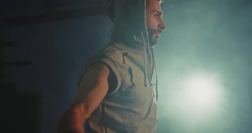 Active Man Jumping Skipping Rope in Sport Club