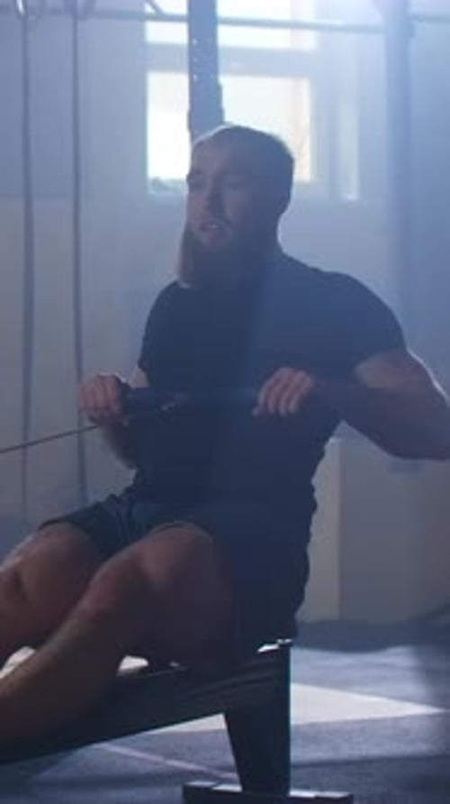 Man on Rowing Machine at a Gym Workout