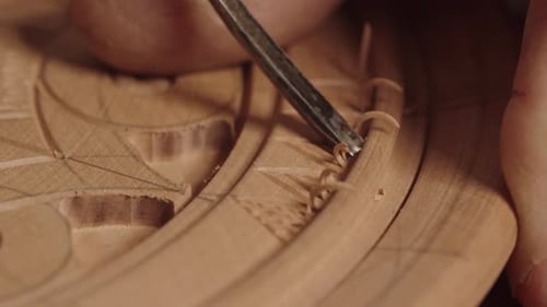 Craftsman Carving Wood with Chisel Close Up