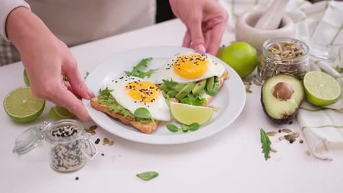 Avocado Toast with Egg on a White Table