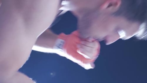 Vertical Video of Male boxer is training. Kickboxing man.