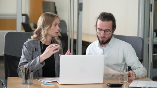Professionals Working Together in Office