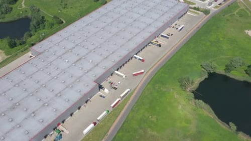 Big Distribution Warehouse Gates Loads Trucks Reversing Loading Dock Aerial