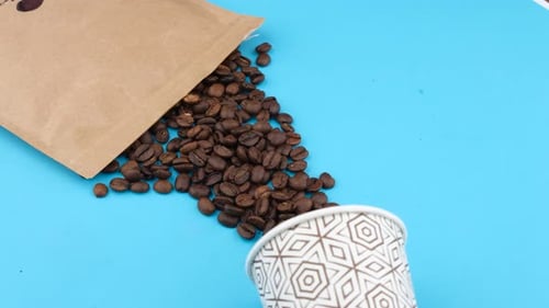 Coffee Beans in Paper Bag and Cup