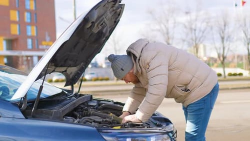 Broken Down on the Side of the Road Man Calls for Emergency Assistance