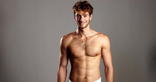 Happy man, face or studio with skincare for dermatology, hygiene or confidence on a gray background