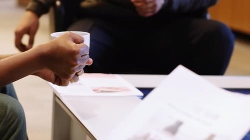 Diverse business team brainstorms ideas at smart touchscreen table in Canada