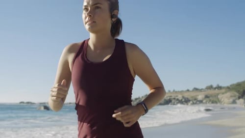 Fitness, woman and running at beach, ocean and sunshine for cardio exercise