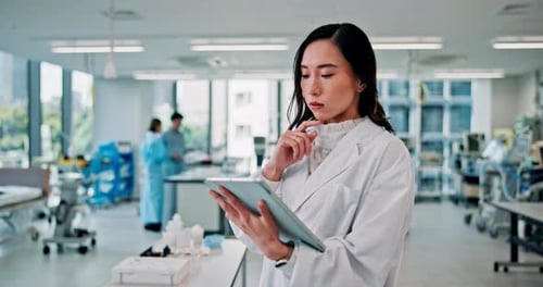 Research, tablet and thinking with Japanese woman in laboratory for medical school