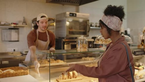 Woman Choosing Pastry to Buy in Bakery
