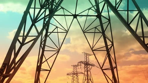 Time Lapse High Voltage Post and Power Lines at Sunset Electricity Pylons in a Row at Sunrise