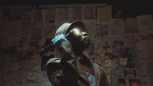 Man With Flashlight Investigates Crime in Dark Room