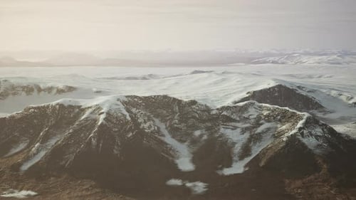 Large Snow Patch Left Over on the Volcanic Rock Field of a Mountain in Summer