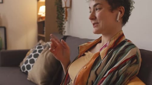 Woman with Prosthetic Arm on Laptop Having Video Call