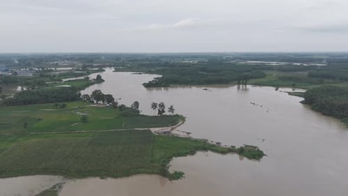 Aerial View Of Flooded Landscape With Trees And Water