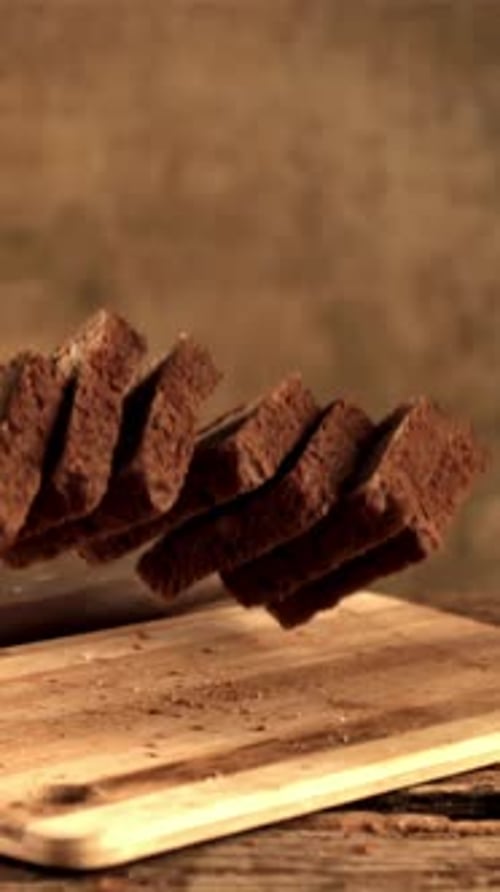 Super Slow Motion on the Cutting Board Fall Pieces of Bread Filmed on a Highspeed Camera at 1000 Fps