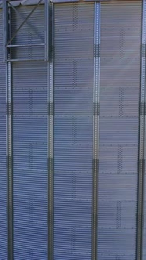 Grain Silo Camera Pans Upward on Sunny Day