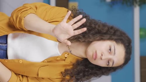 Young Woman Gesturing in Home Interior