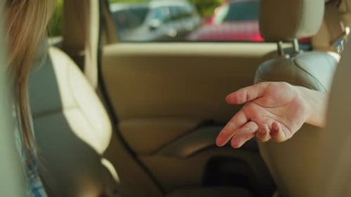 Passing Money Inside of a Car in Daylight