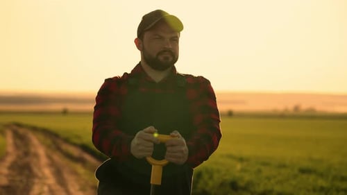 Inspired Male Farmer Viewing Large Farmland in Countryside Agribusiness Farm Worker Leaning on