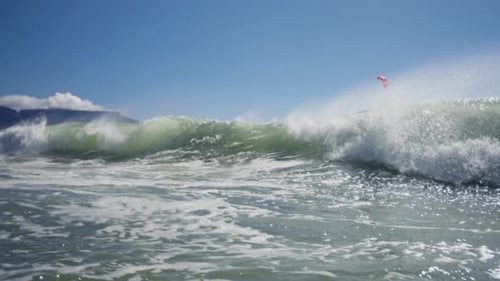 Powerful waves crashing and hitting the camera screen. Low angle close up view.