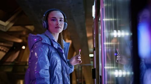 Girl Touching Snack Automat Making Choice Standing in Night City Subway Close Up